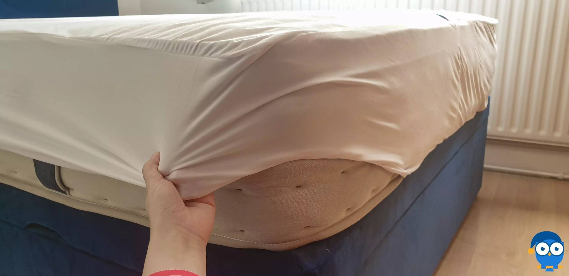 Putting on DreamCloud mattress protector